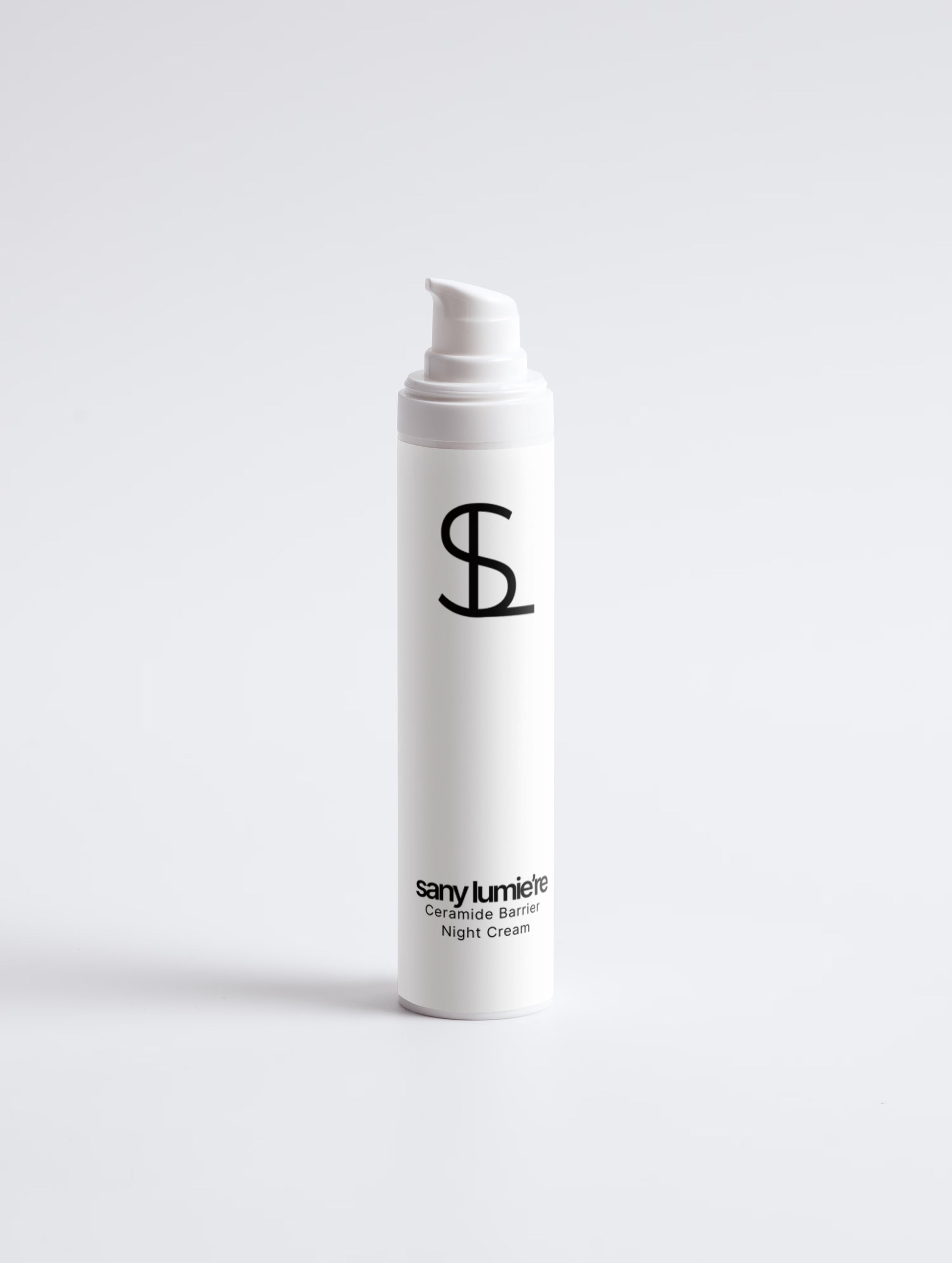 White cream bottle with black logo and text on a white background
