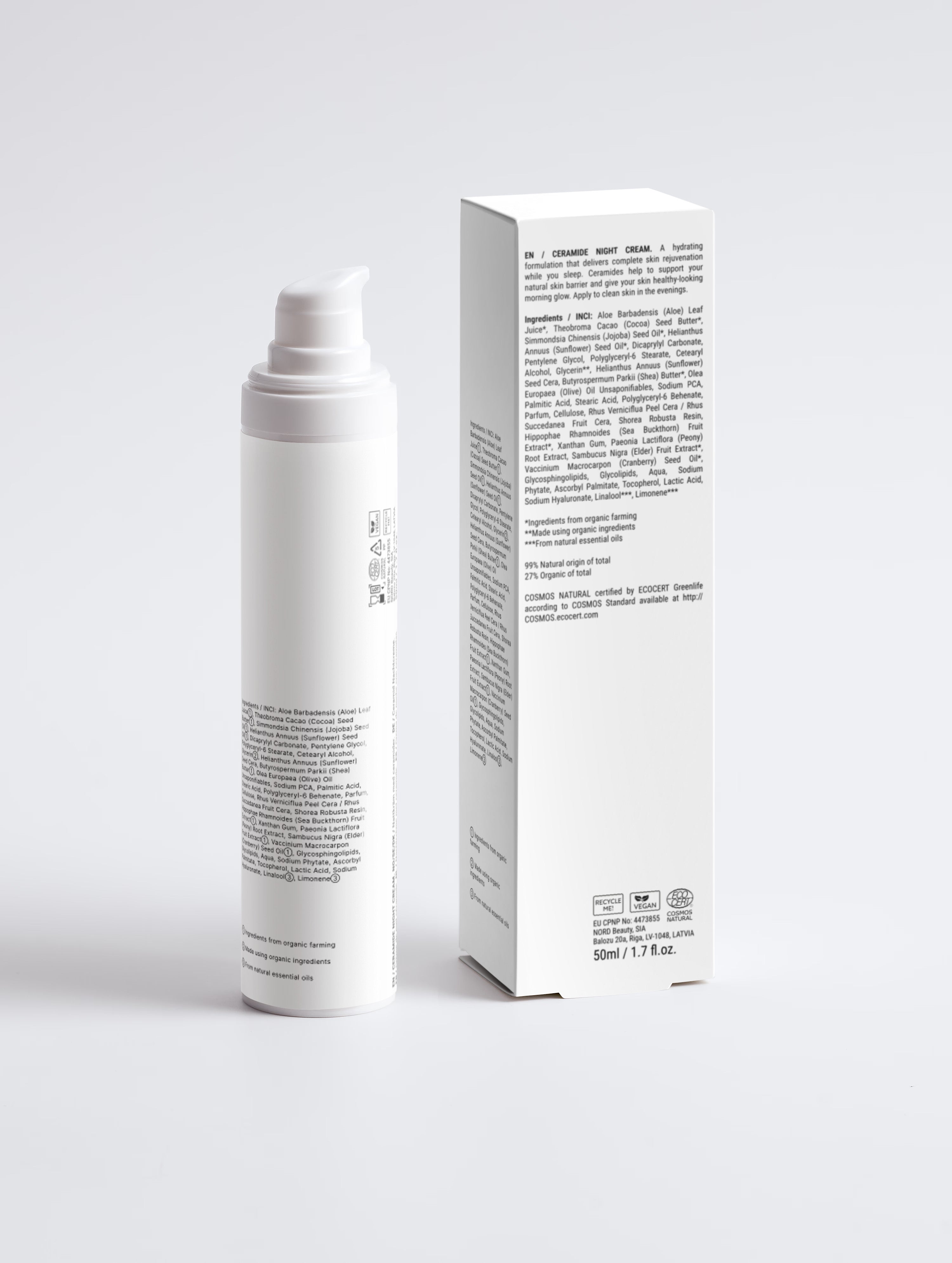 White cosmetic bottle and box on a light gray background